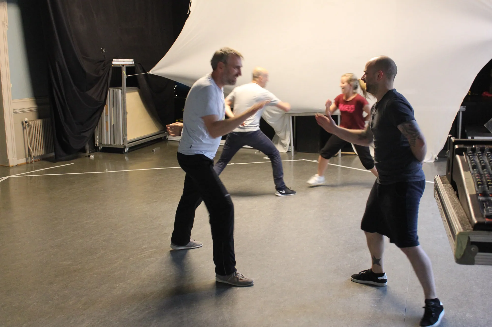 Participants at an event warming up before fencing.